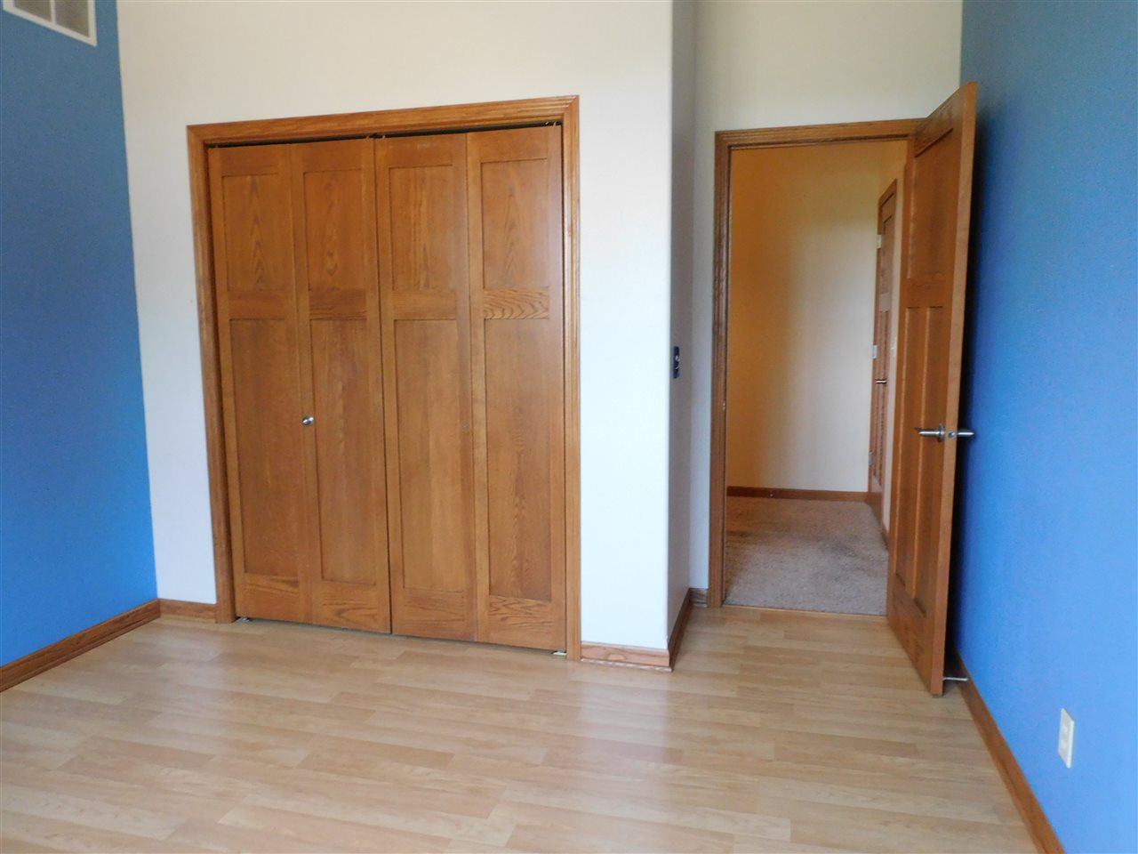 3265 Bloods Point Road Kirkland, IL 60146 - Photo 22 of 35 an empty room with wooden floor and closet area
