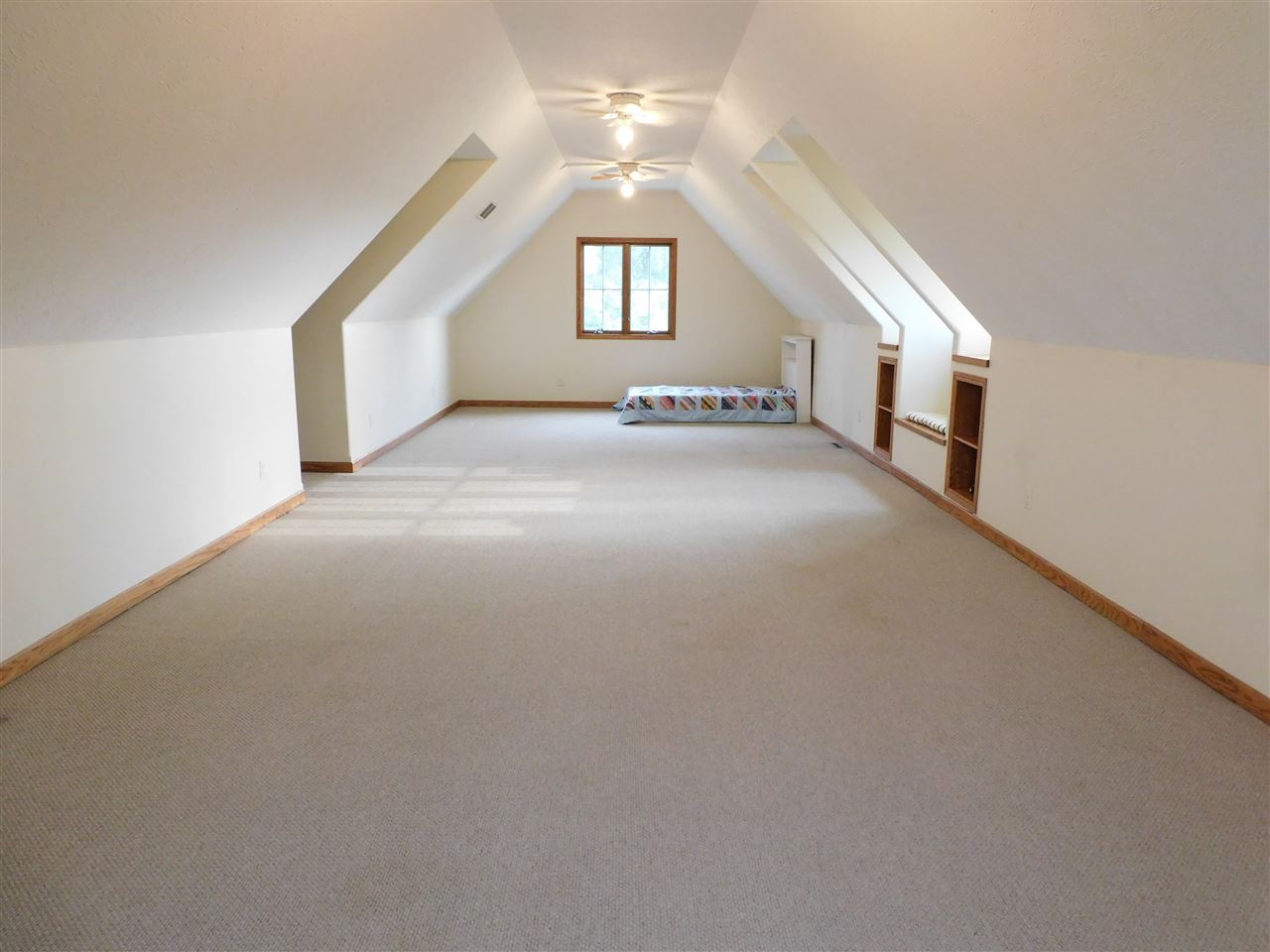 3265 Bloods Point Road Kirkland, IL 60146 - Photo 24 of 35 a view of a big room with windows and chandelier fan