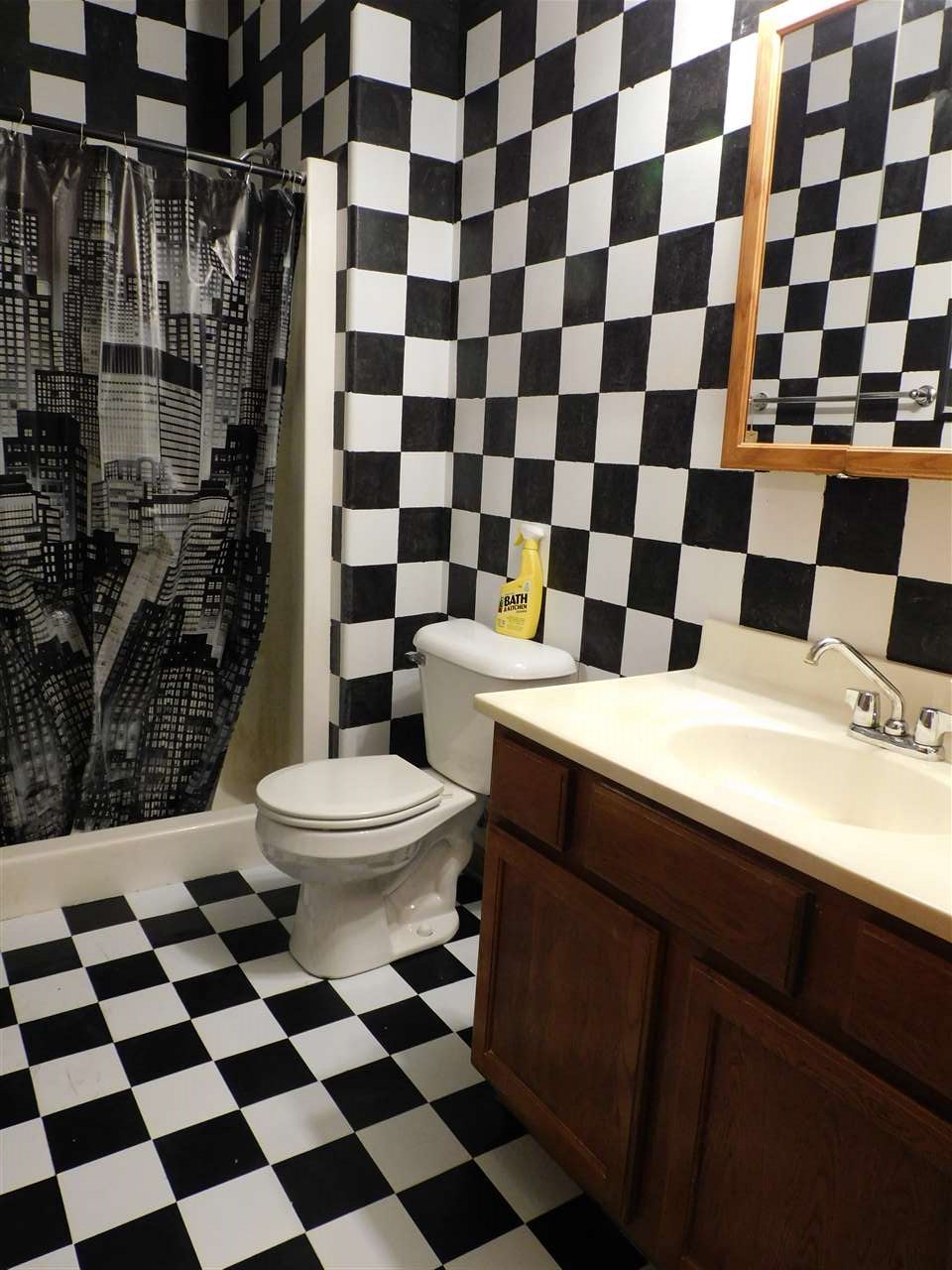 3265 Bloods Point Road Kirkland, IL 60146 - Photo 26 of 35 a bathroom with a black and white checkered floor