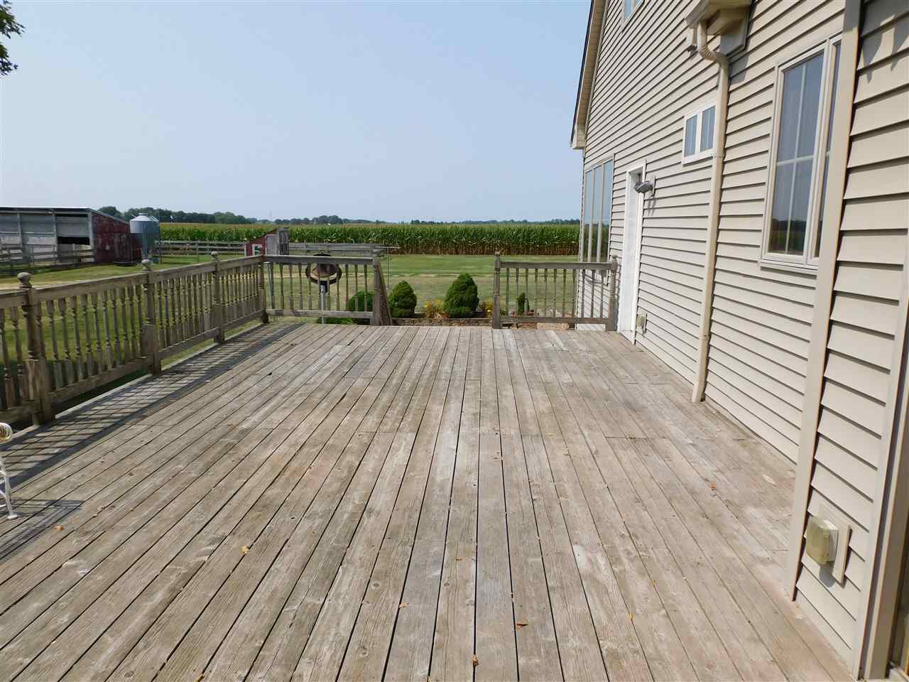 3265 Bloods Point Road Kirkland, IL 60146 - Photo 27 of 35 a view of a balcony with wooden floor and city view