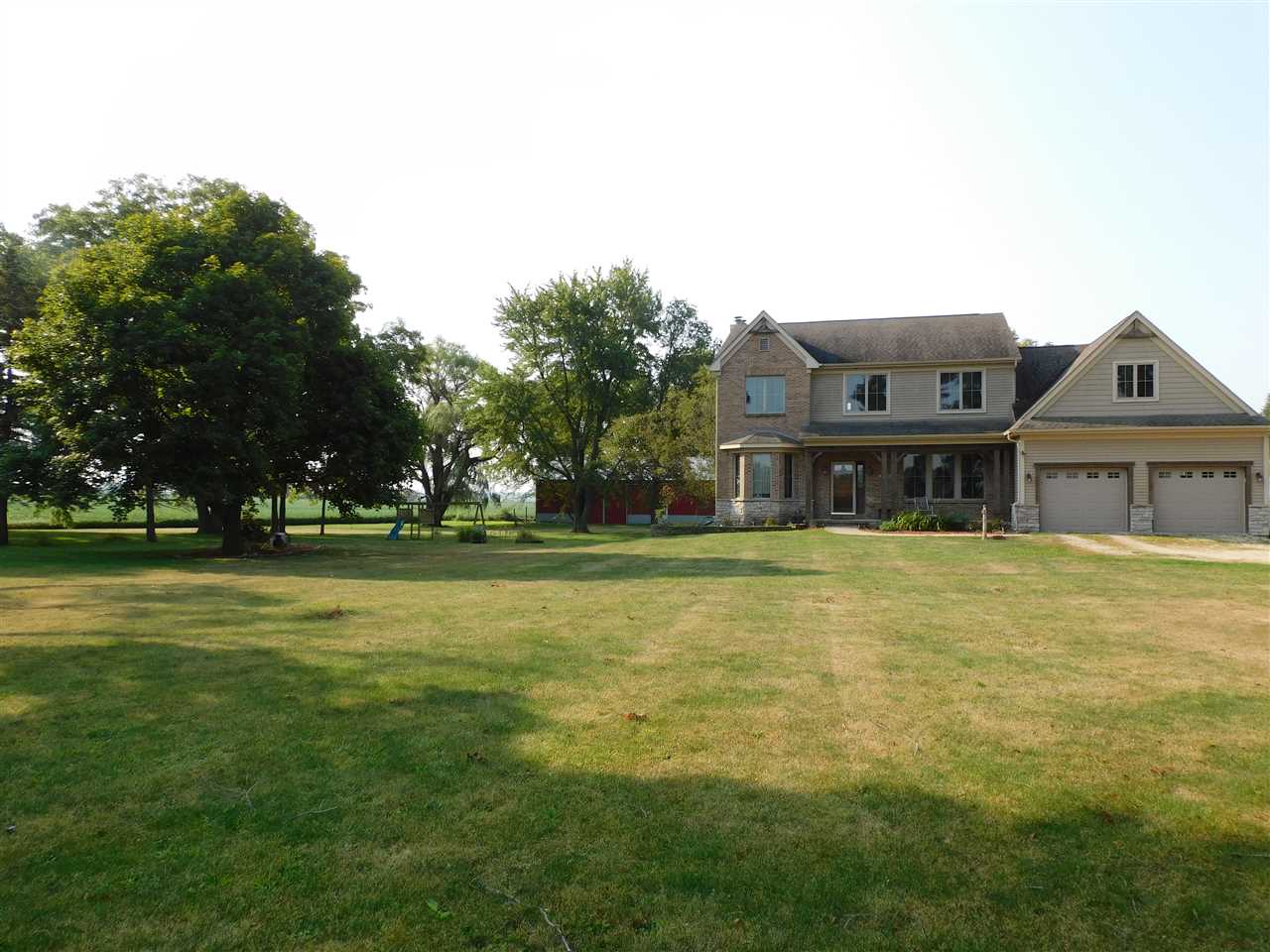 3265 Bloods Point Road Kirkland, IL 60146 - Photo 29 of 35 a front view of house with outdoor space and trees in the background