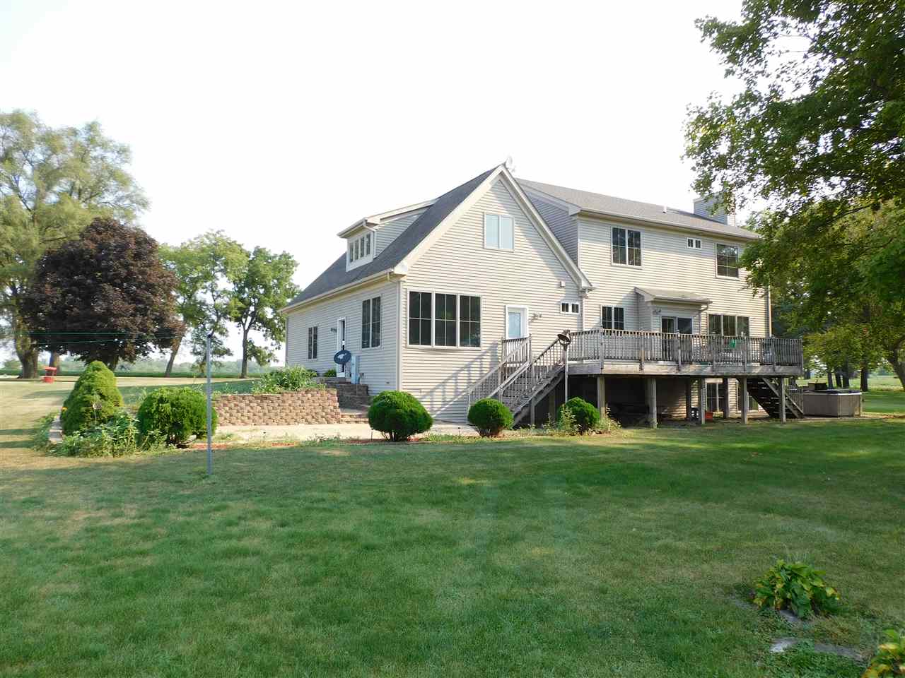 3265 Bloods Point Road Kirkland, IL 60146 - Photo 33 of 35 a view of a house with a yard deck and sitting area
