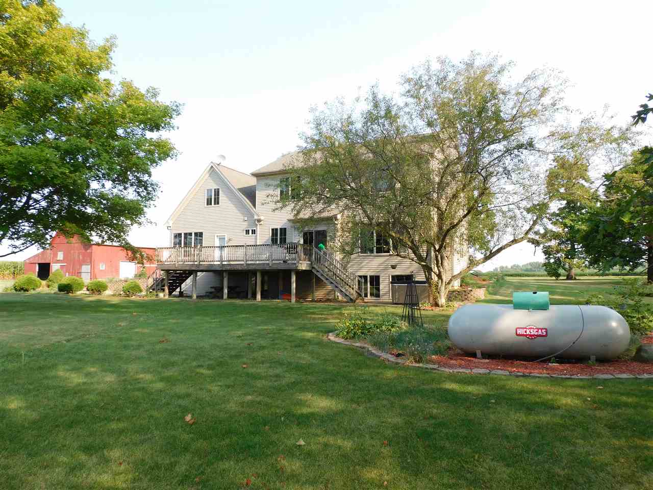 3265 Bloods Point Road Kirkland, IL 60146 - Photo 34 of 35 a front view of a house with garden and trees