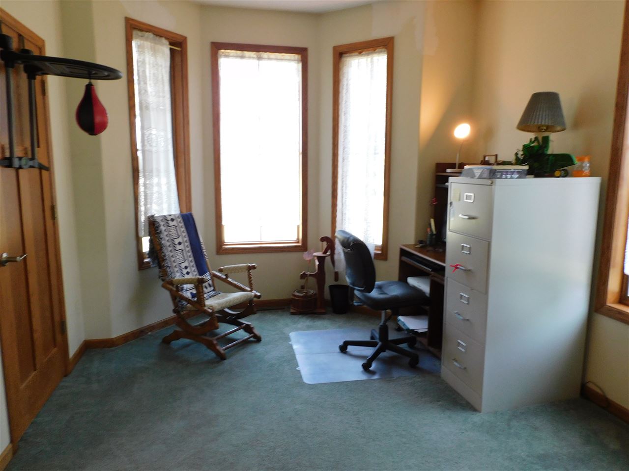 3265 Bloods Point Road Kirkland, IL 60146 - Photo 5 of 35 a view of a workspace with furniture and a window