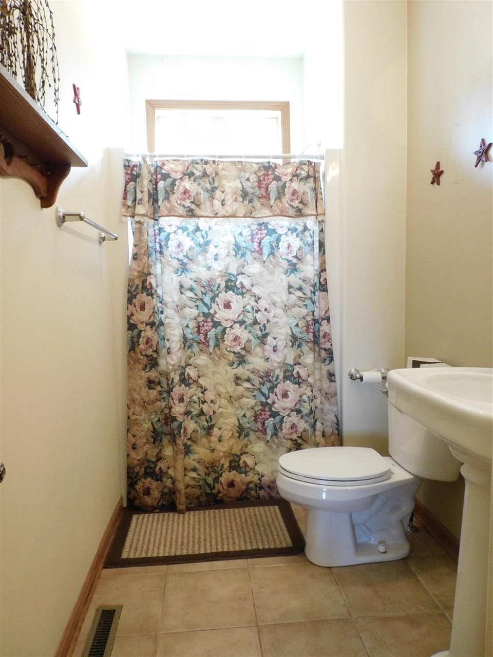 3265 Bloods Point Road Kirkland, IL 60146 - Photo 7 of 35 a bathroom with a toilet and a shower