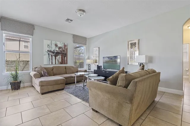 a living room with furniture and a large window