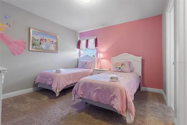 a bathroom with a sink vanity and toilet