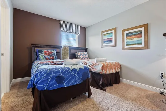 a view of a patio with a table chairs and a potted plant
