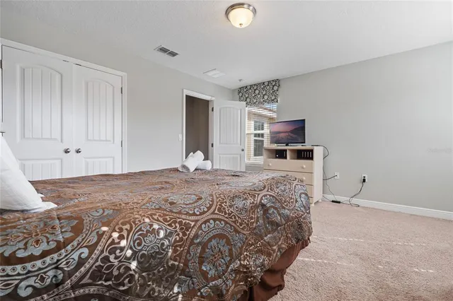 a view of a house with backyard and garden