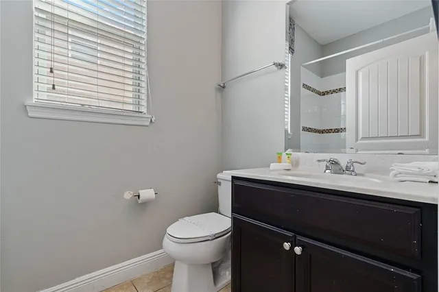 a view of swimming pool with a garden and plants