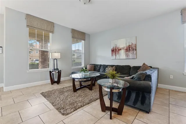 a living room with furniture and a large window
