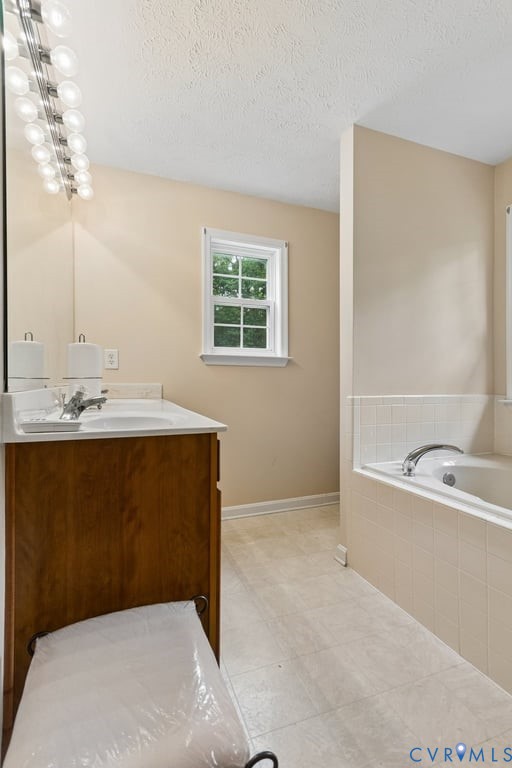83 Albertson Court Ruther Glen, VA 22546 - Photo 23 of 25 Bathroom featuring a built-in tub with tiled surro