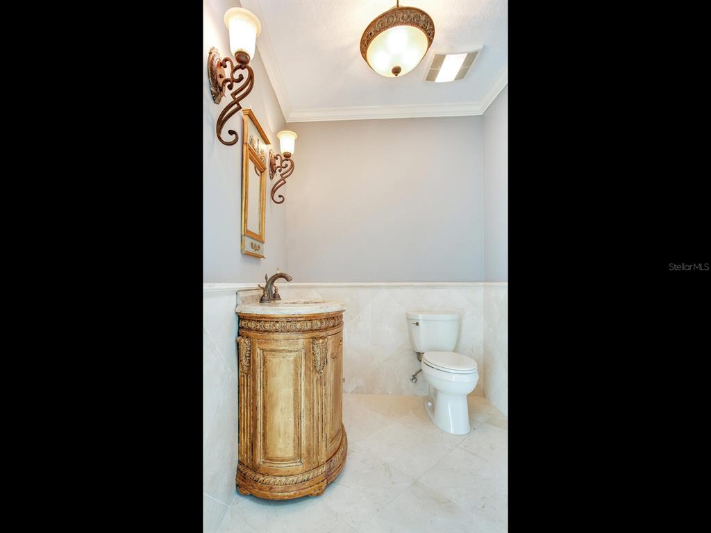 3507 Bayshore Boulevard, Unit 1202 Tampa, FL 33629 - Photo 11 of 68 a bathroom with a toilet sink and mirror