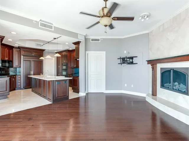 a bathroom with a glass shower door and mirror