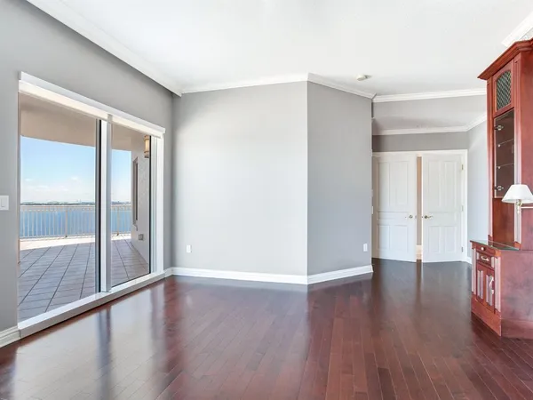 a view of a room with wooden floor