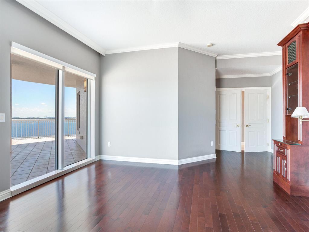 3507 Bayshore Boulevard, Unit 1202 Tampa, FL 33629 - Photo 22 of 68 a view of an empty room with wooden floor and a window