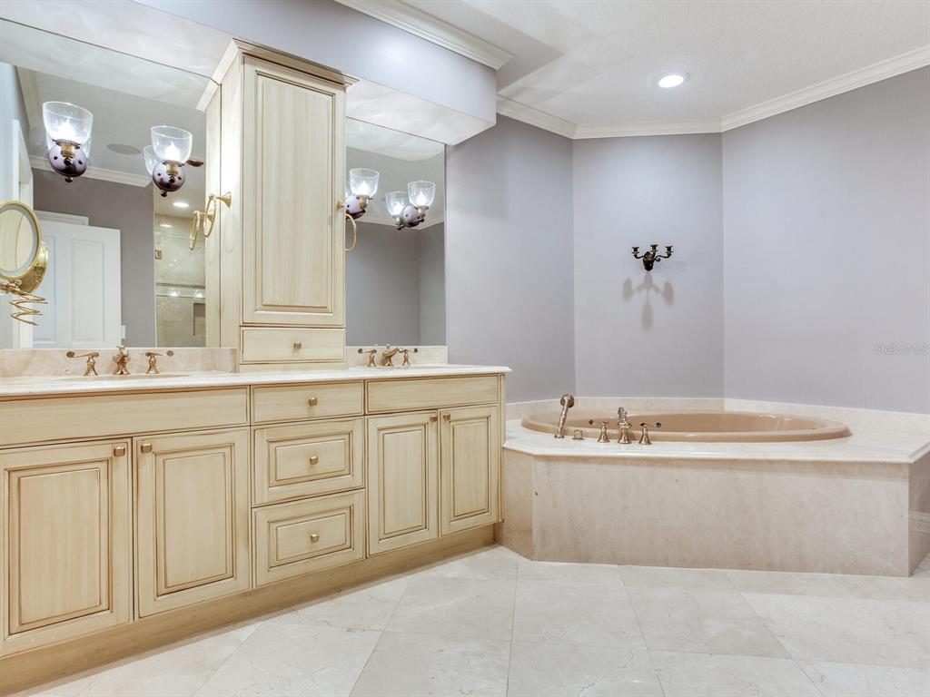3507 Bayshore Boulevard, Unit 1202 Tampa, FL 33629 - Photo 28 of 68 a bathroom with a sink double vanity mirror and a bathtub