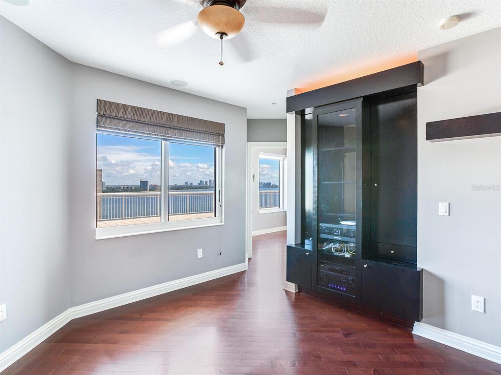 3507 Bayshore Boulevard, Unit 1202 Tampa, FL 33629 - Photo 30 of 68 an empty room with wooden floor and windows