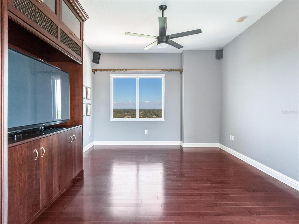 3507 Bayshore Boulevard, Unit 1202 Tampa, FL 33629 - Photo 35 of 68 a view of an empty room with wooden floor and a window