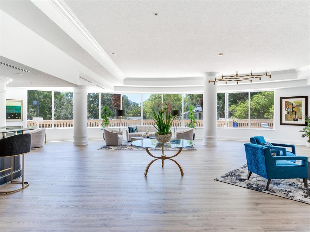 3507 Bayshore Boulevard, Unit 1202 Tampa, FL 33629 - Photo 54 of 68 a living room with fireplace furniture and floor to ceiling windows