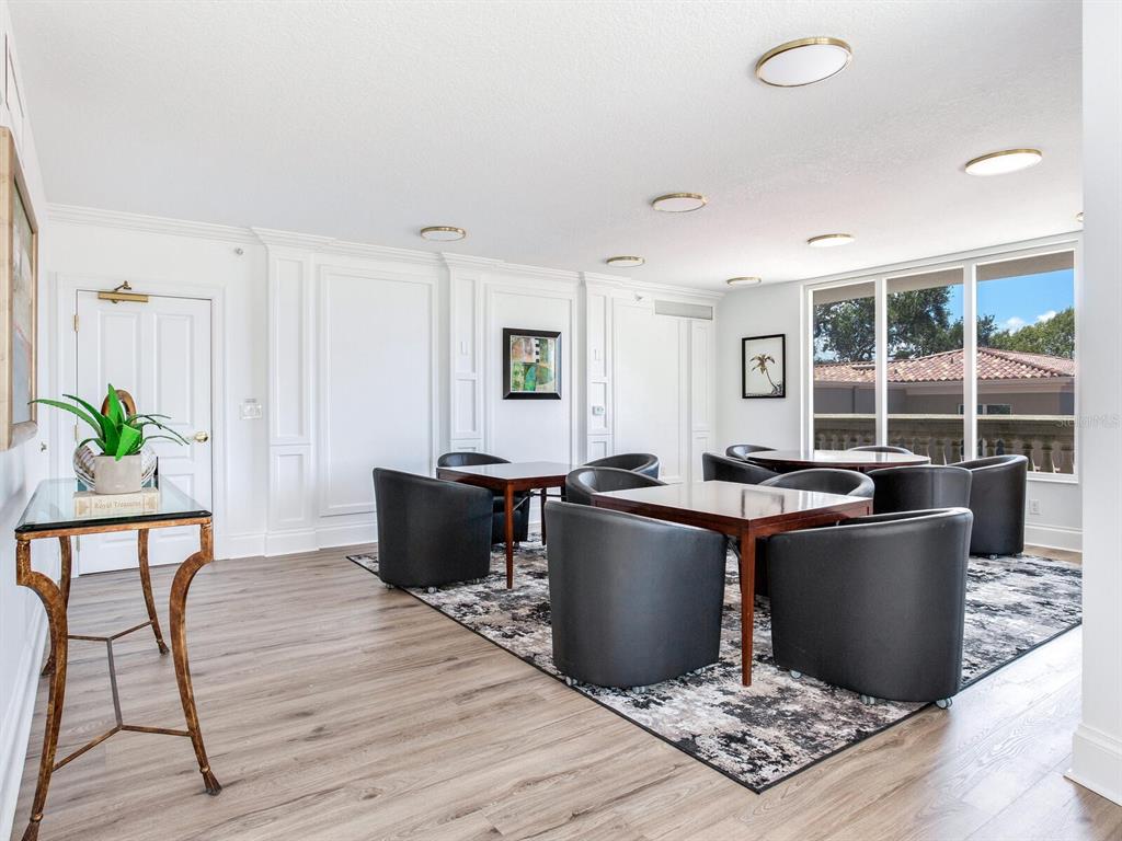 3507 Bayshore Boulevard, Unit 1202 Tampa, FL 33629 - Photo 60 of 68 a living room with furniture a large window and wooden floor