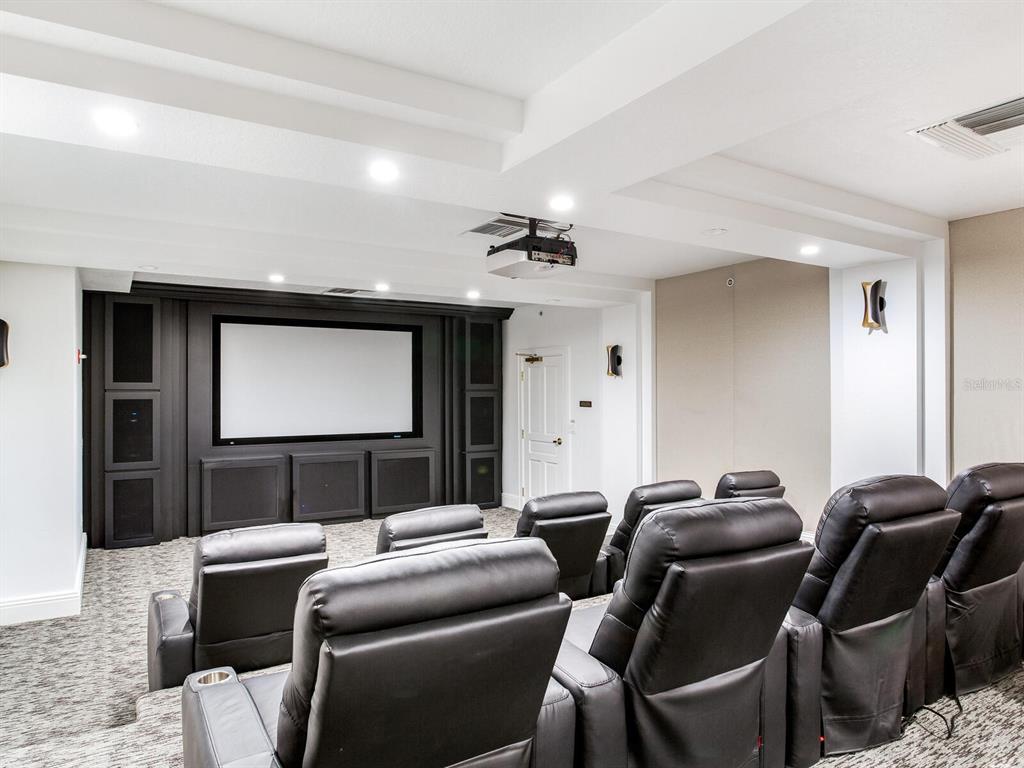 3507 Bayshore Boulevard, Unit 1202 Tampa, FL 33629 - Photo 62 of 68 a media room with lots of chairs and a projector screen