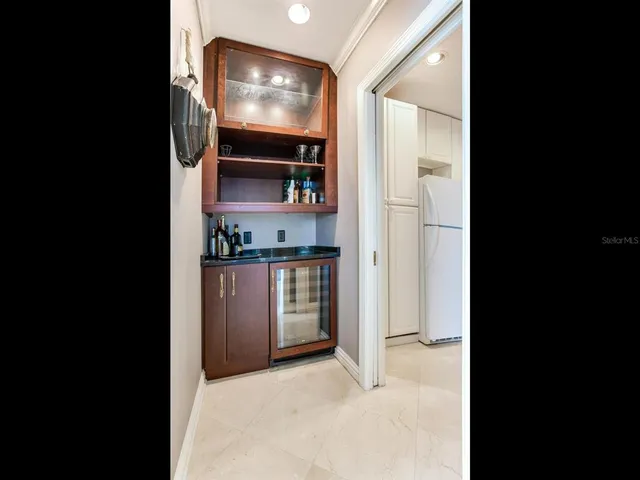 a kitchen with a sink stainless steel appliances and cabinets