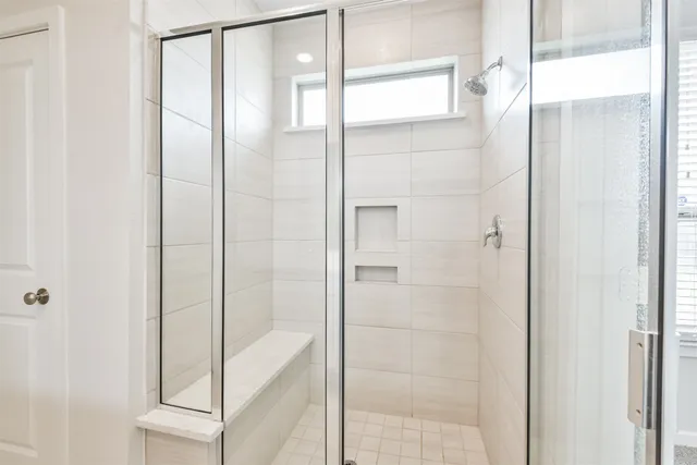 a bathroom with double sink and a mirror
