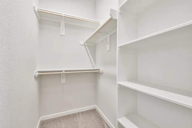 a view of an empty walk in closet