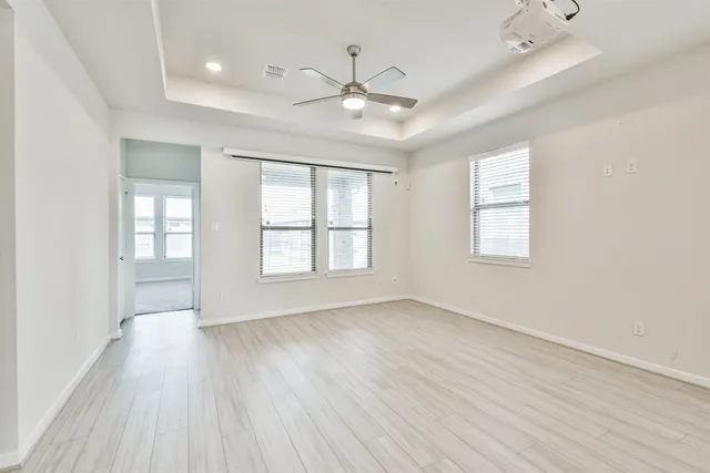 a view of a kitchen with a dishwasher cabinets and wooden floor