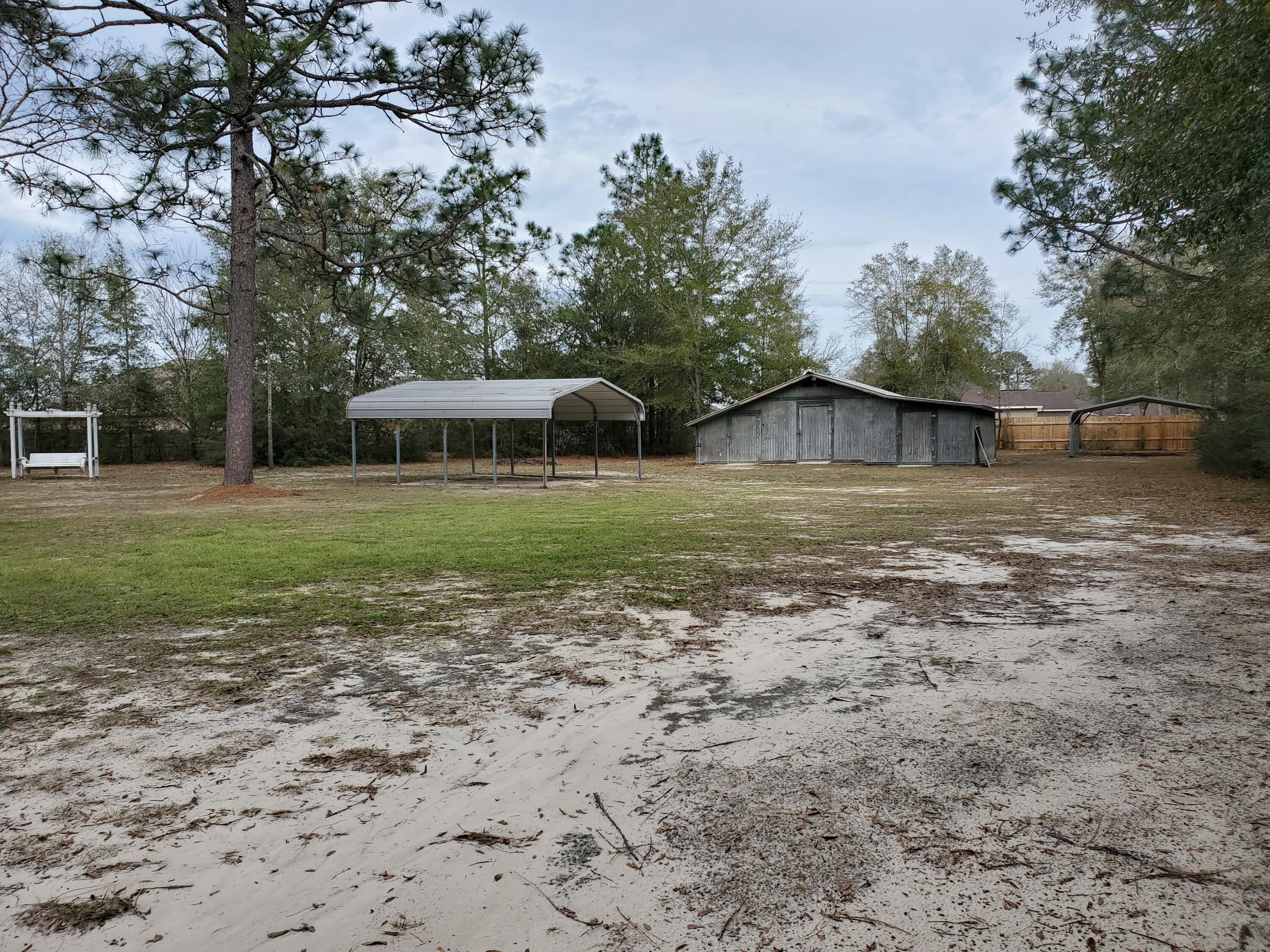 6197 Sundew Street Crestview, FL 32539 - Photo 28 of 34 Two 18' x 20' carports!