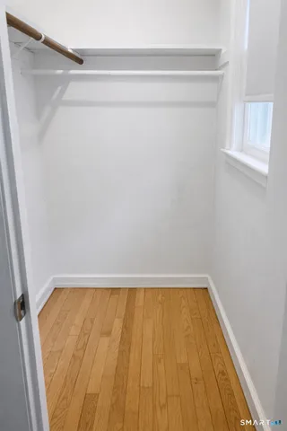 a kitchen with stainless steel appliances granite countertop a sink a stove a microwave and cabinets