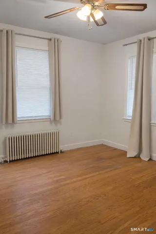 a kitchen with a refrigerator sink and cabinets