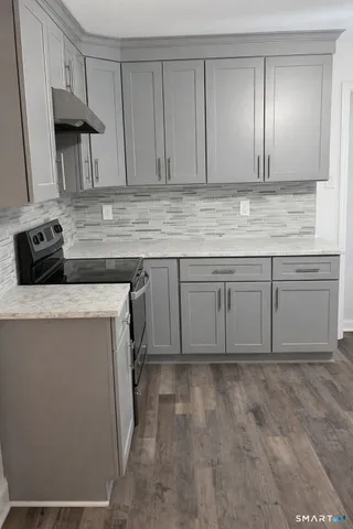 a view of kitchen with furniture and window