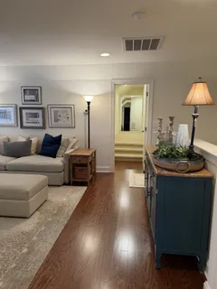 a bed room with furniture and a flat screen tv