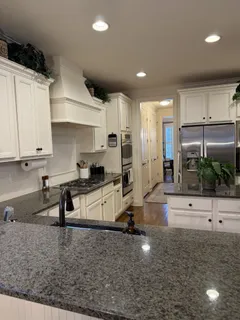 a kitchen with counter top space cabinets and stainless steel appliances