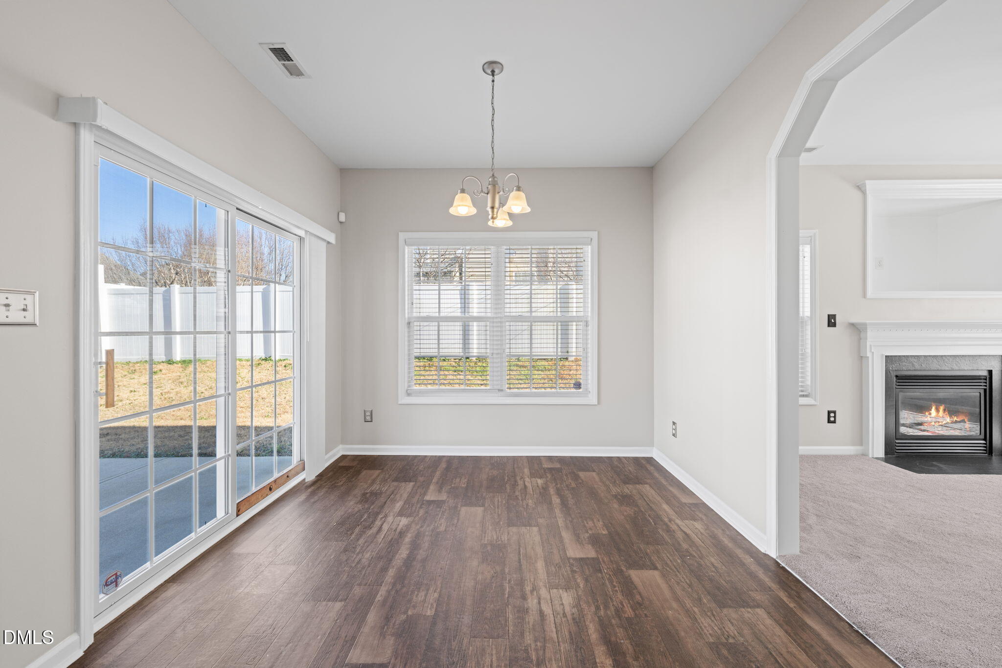 4112 Bay Rum Lane Raleigh, NC 27610 - Photo 11 of 43 wooden floor in an empty room with a window