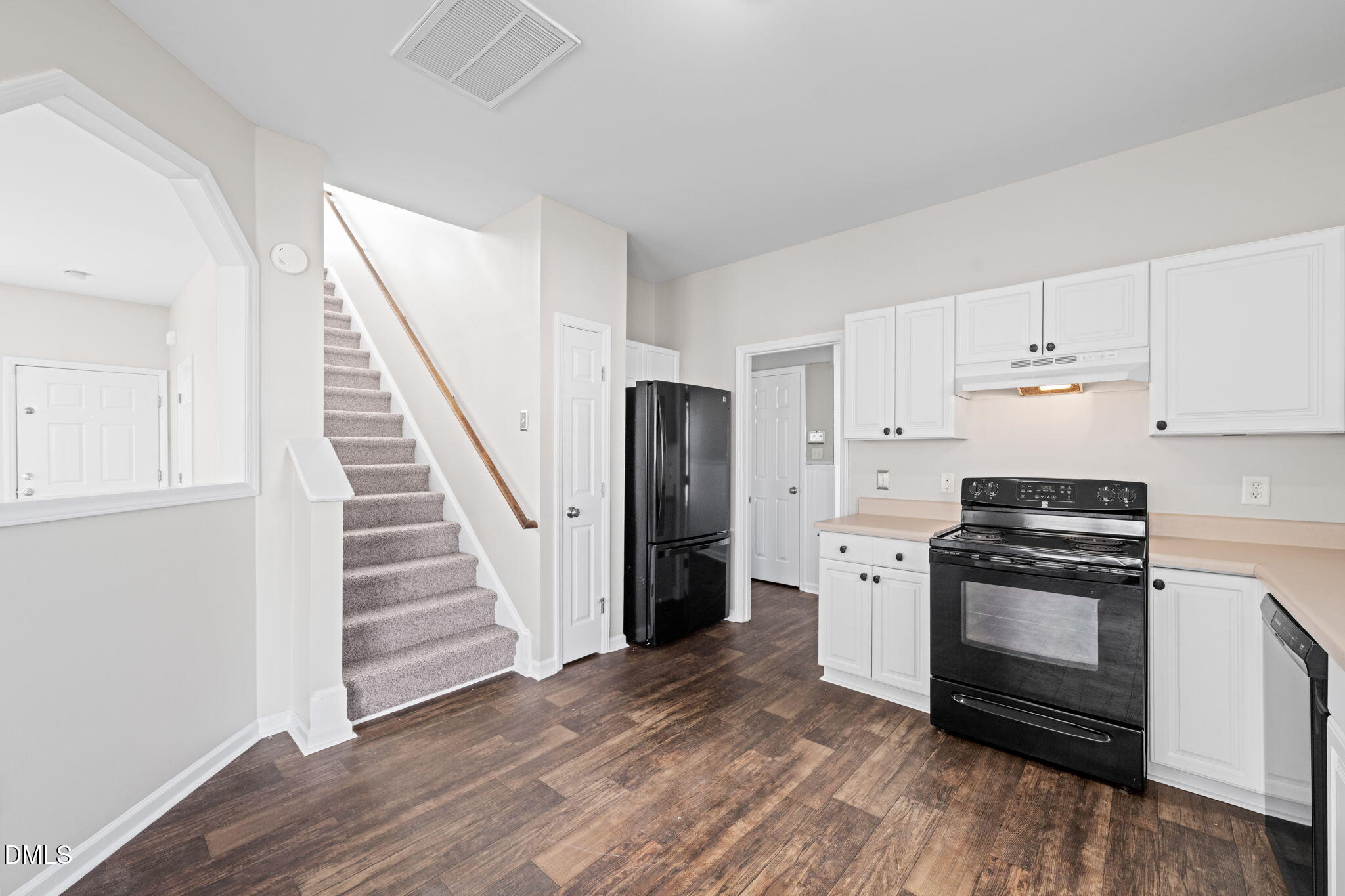 4112 Bay Rum Lane Raleigh, NC 27610 - Photo 13 of 43 a kitchen with a stove a refrigerator and a sink
