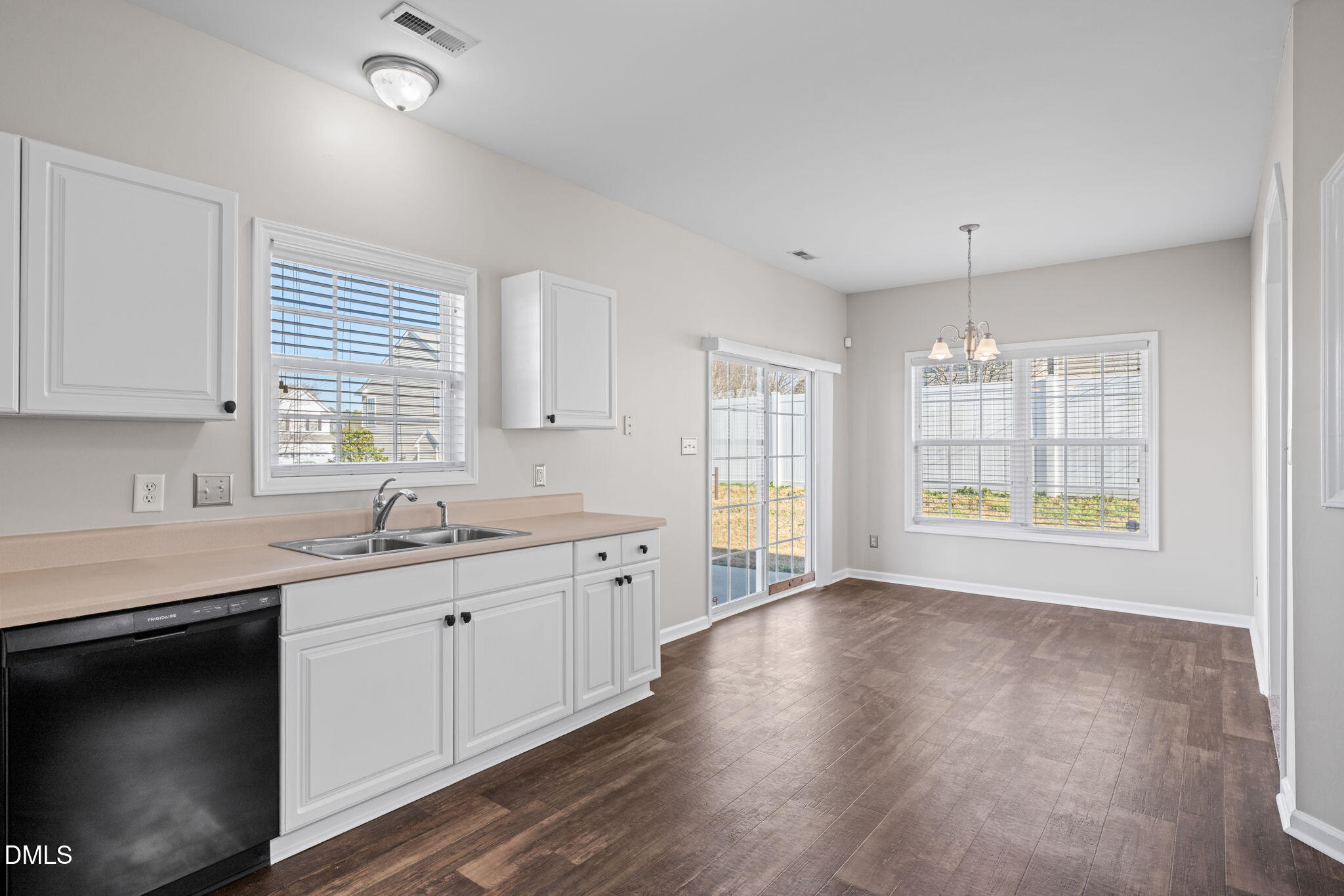 4112 Bay Rum Lane Raleigh, NC 27610 - Photo 17 of 43 a kitchen with stainless steel appliances granite countertop a sink a stove a refrigerator and island with wooden floor