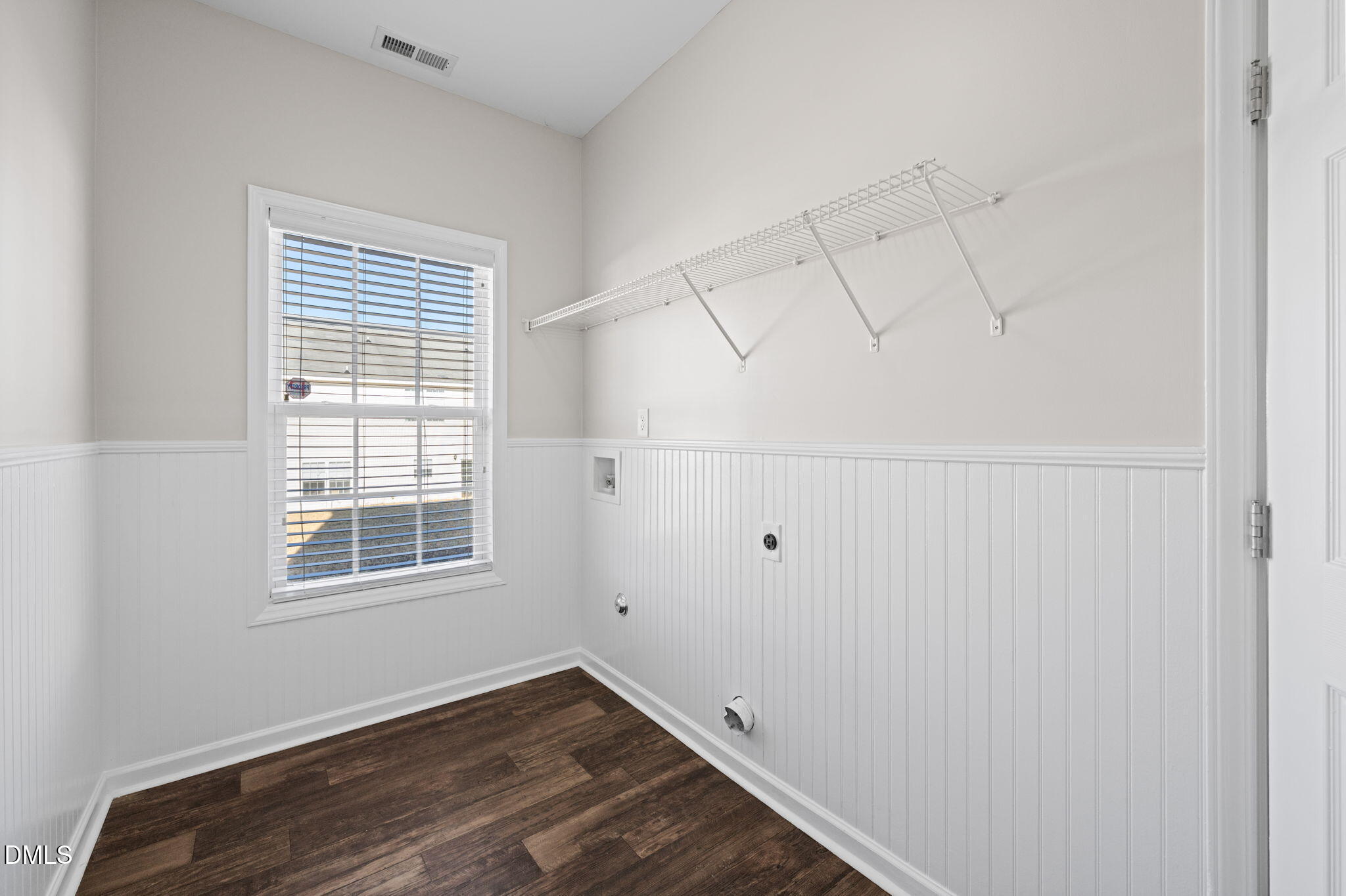 4112 Bay Rum Lane Raleigh, NC 27610 - Photo 20 of 43 a view of a room with rack on the wall and a window