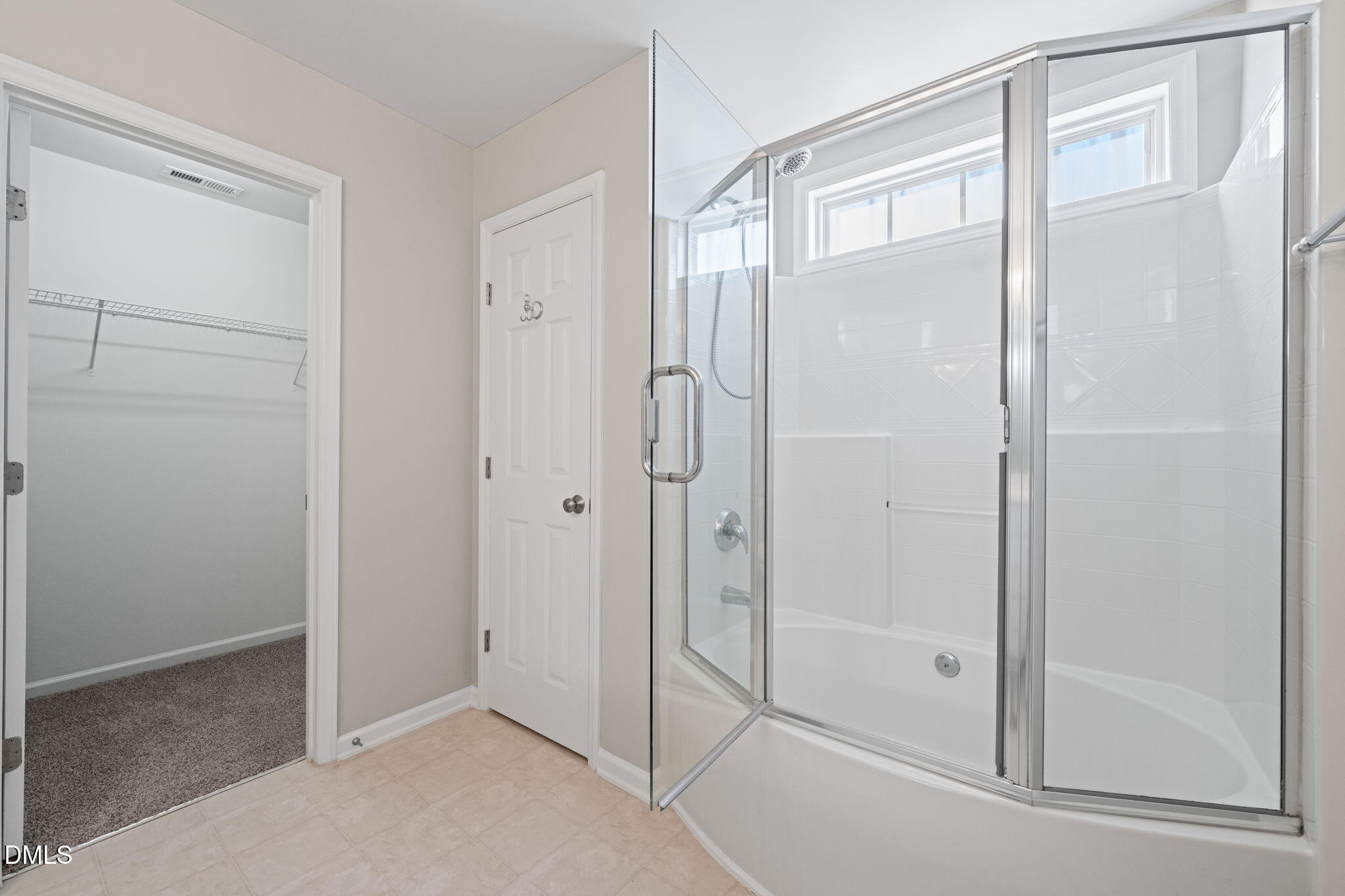 4112 Bay Rum Lane Raleigh, NC 27610 - Photo 26 of 43 a bathroom with a glass shower door
