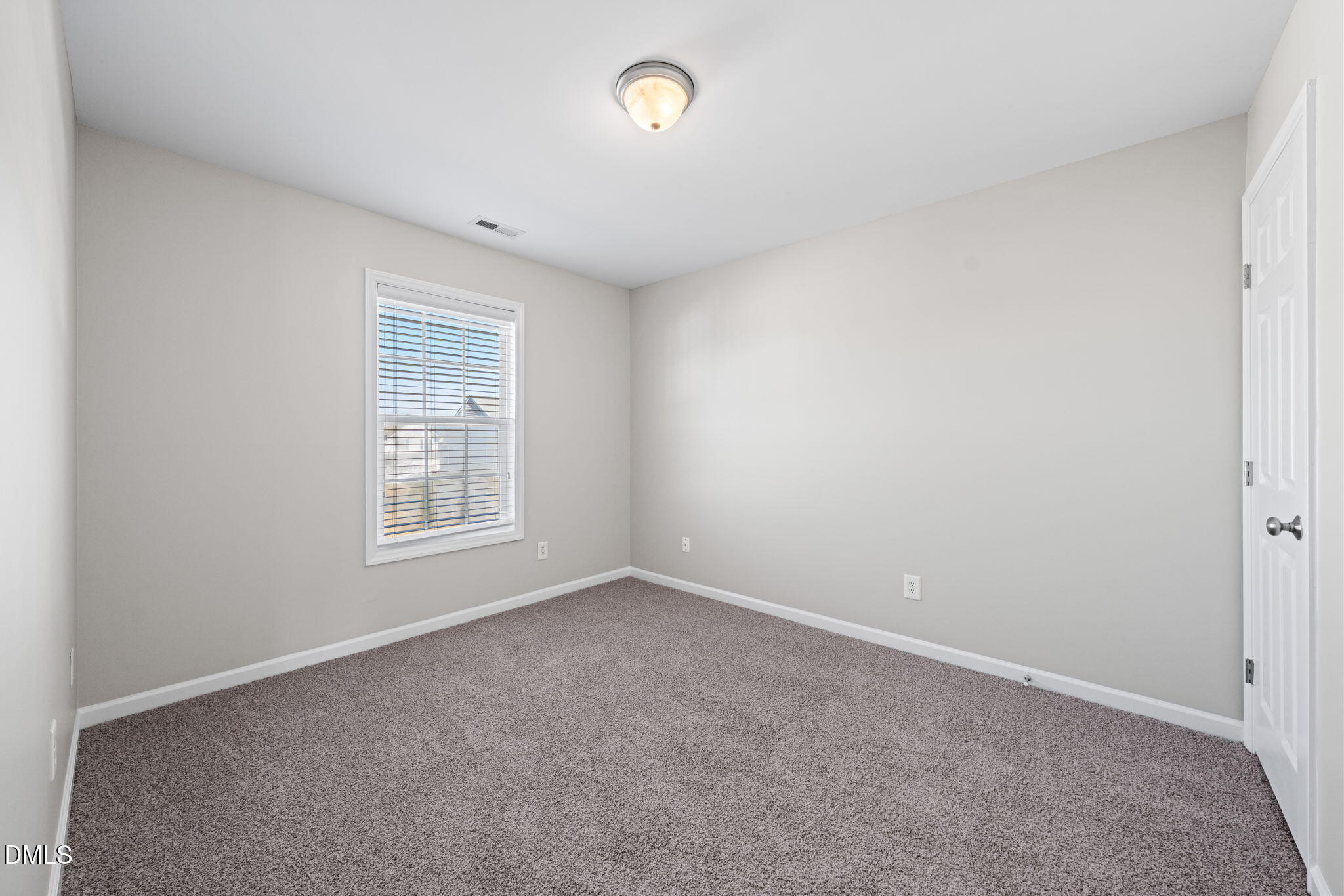 4112 Bay Rum Lane Raleigh, NC 27610 - Photo 32 of 43 an empty room with a window