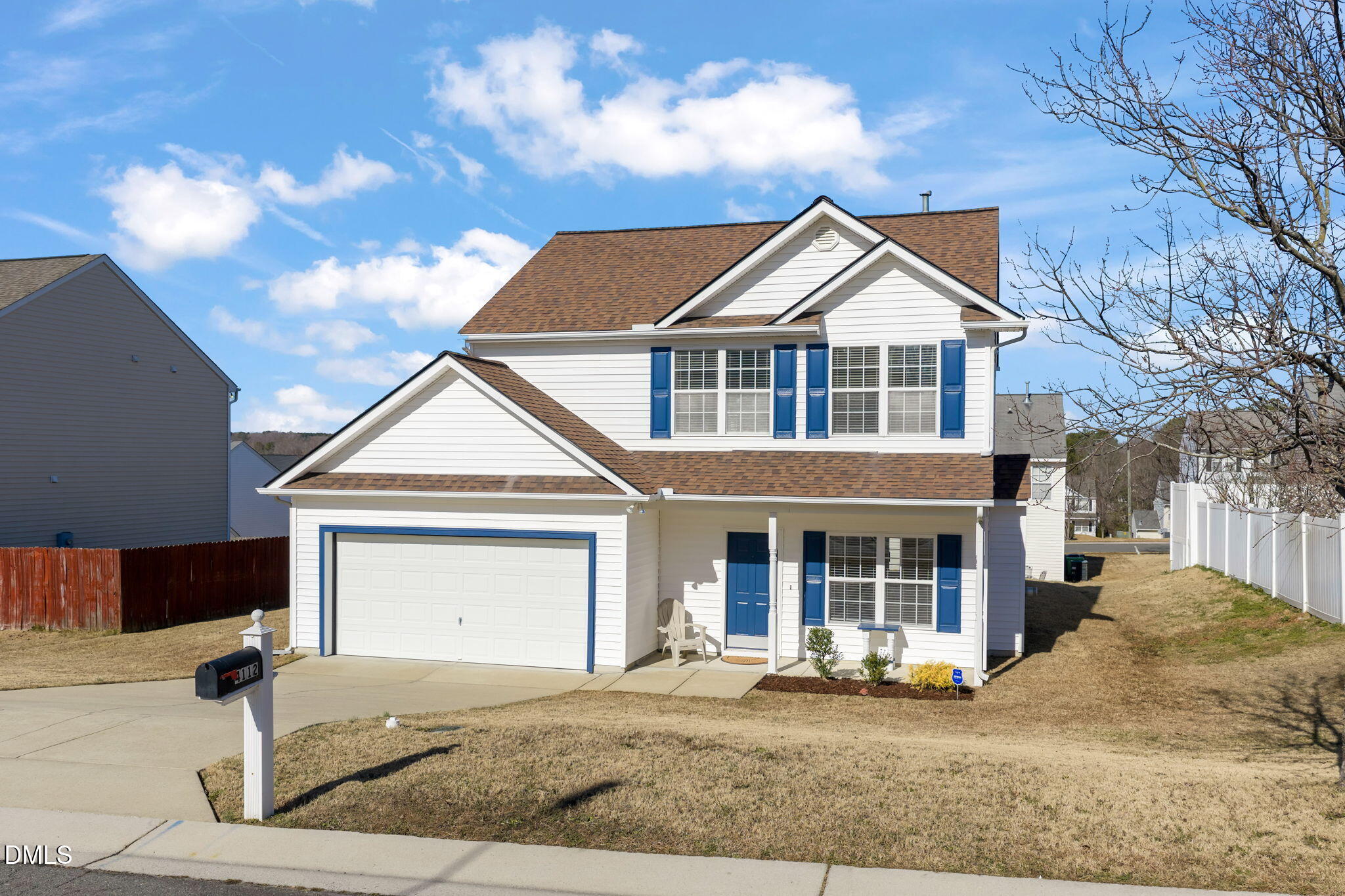4112 Bay Rum Lane Raleigh, NC 27610 - Photo 38 of 43 a front view of a house with a yard and garage