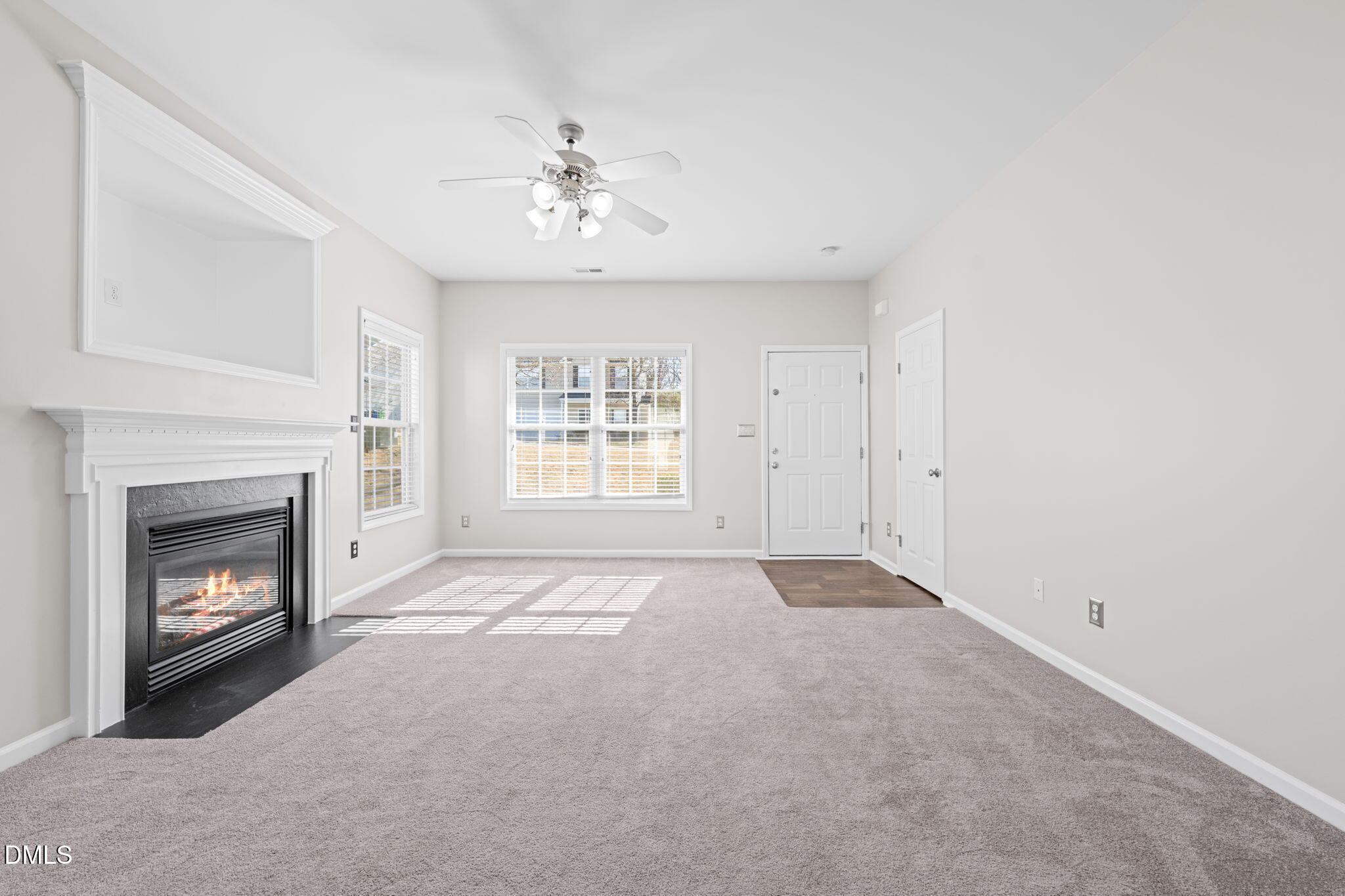 4112 Bay Rum Lane Raleigh, NC 27610 - Photo 8 of 43 a view of an empty room with a fireplace