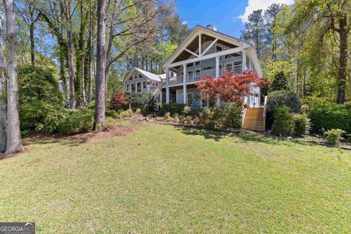 1320 Tal Lewis Road White Plains, GA 30678 - Photo 4 of 19 a front view of house with yard and trees around