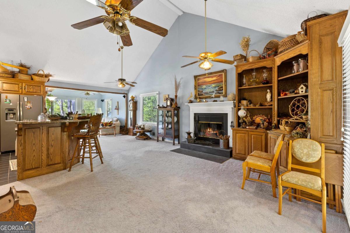 1320 Tal Lewis Road White Plains, GA 30678 - Photo 10 of 19 a view of a livingroom with furniture and a fireplace