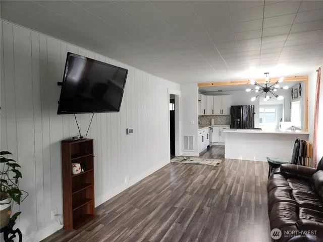 a view of a livingroom with furniture and a window