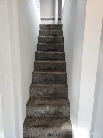 a view of empty room with ceiling fan