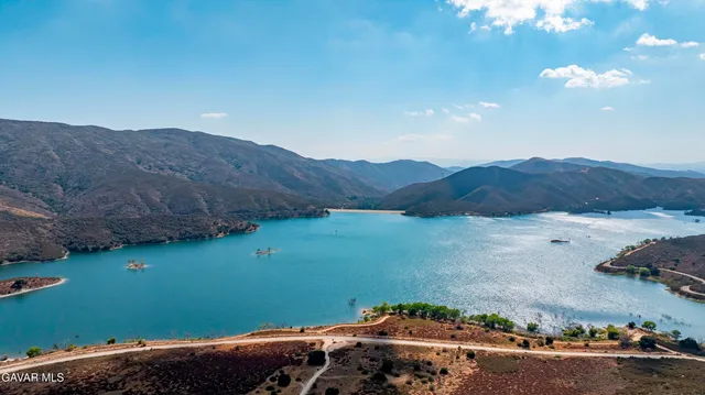 an aerial view of a residential houses with street