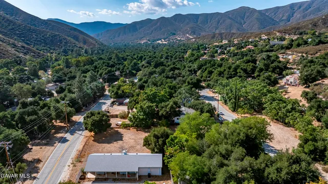an aerial view of house with yard